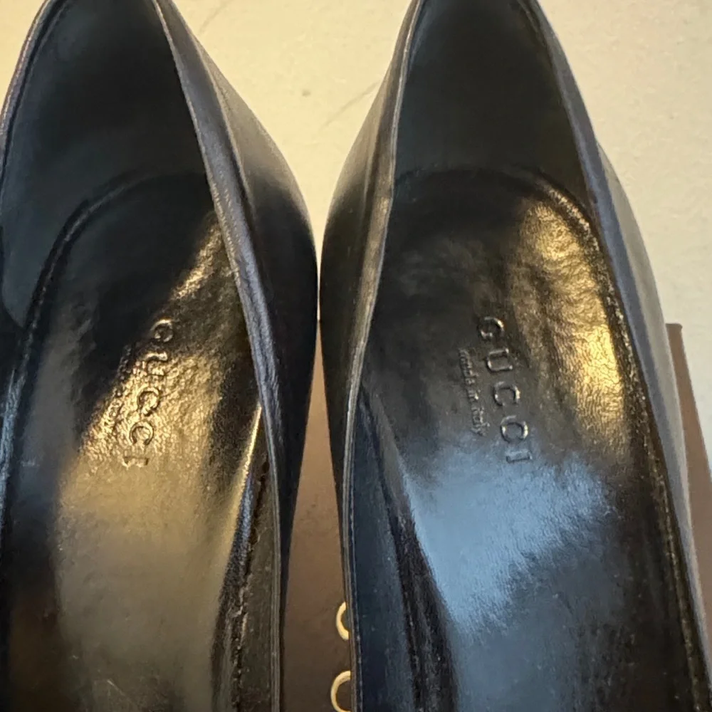 Gucci Black Heels with Iconic Gucci Gold Emblem